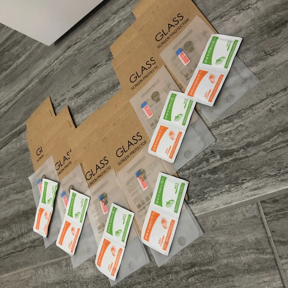 Six pack of iPhone 5s glass screen protectors with wipes to clean phone & screen